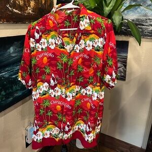 Vintage “Curaçao” tropic/Hawaiian style shirt in used condition.